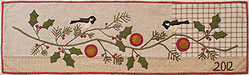 Pine And Holly applique table runner quilt pattern by Norma Whaley